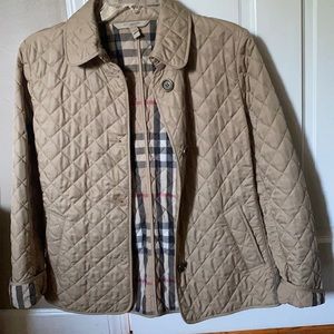 Classic Burberry coat , has a stain